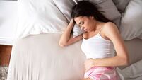 Girl lying on the bed, period, stomach pain, menstrual cycle