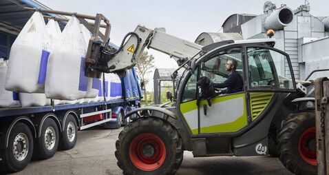 Farmer Receiving  A Delivery Of Nitrogen Sulphur Fertiliser To A Sustainable Farm.