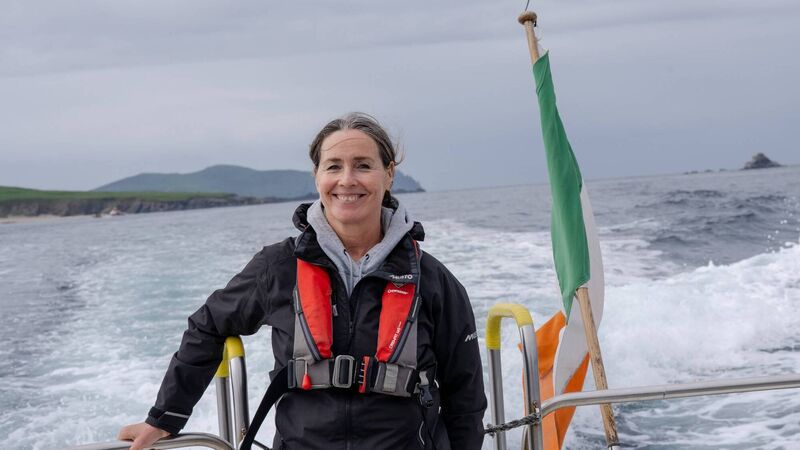Helena Ni Chonchuir on a boat off the coast of Dingle Helena Ni Chonchuir on a boat off the coast of Dingle