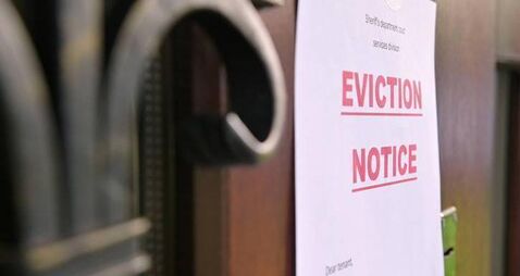 the notice of eviction of tenants hangs on the door of the house