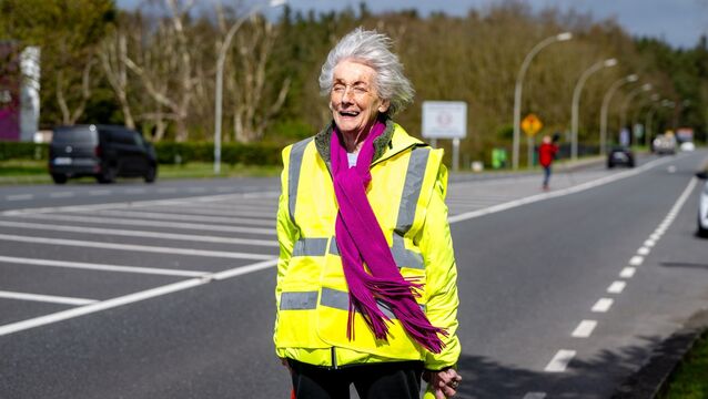 <p>Lelia Doolan looks ahead to the long road before her as she begins her walk from Shannon Airport to Dublin, a journey aimed at raising awareness around peace and Ireland’s neutrality. Picture: Chani Anderson</p>