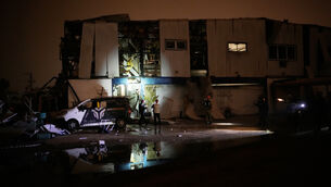 <p>Israeli security forces and rescue teams inspect a site struck by an Iranian missile in Petah Tikva on Thursday. Picture: Ohad Zwigenberg/AP</p>