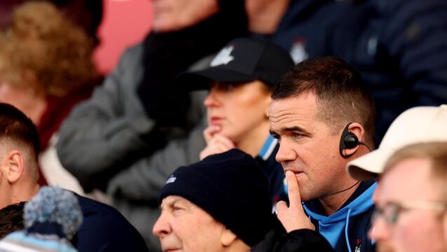 <p>WIRED FOR SOUND: Dublin’s manager Ger Brennan watches on from the stands after being red carded. Pic: INPHO/James Crombie</p>