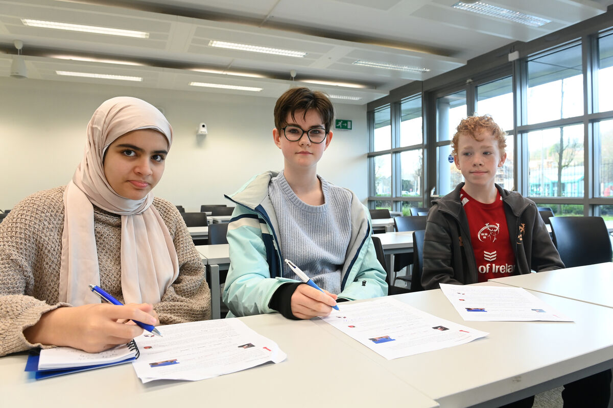  Junior students Habiba, Charlotte and Ciaran enjoy the maths challenges on a Saturday morning at UCC. 