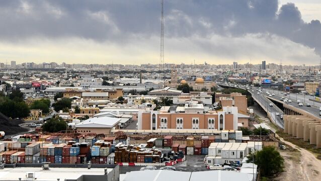<p>Smoke rises from Kuwait international airport after a drone strike on fuel storage (AP)</p>