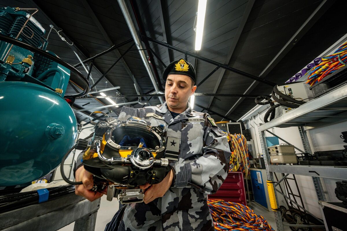 Lt Jason Croke reflected in the visor of a Kirby Morgan diving helmet in a secure warehouse housing an array of specialist equipment at Haulbowline Naval Base in Cork. Picture: Chani Anderson Lt Jason Croke reflected in the visor of a Kirby Morgan diving helmet in a secure warehouse housing an array of specialist equipment at Haulbowline Naval Base in Cork. Picture: Chani Anderson