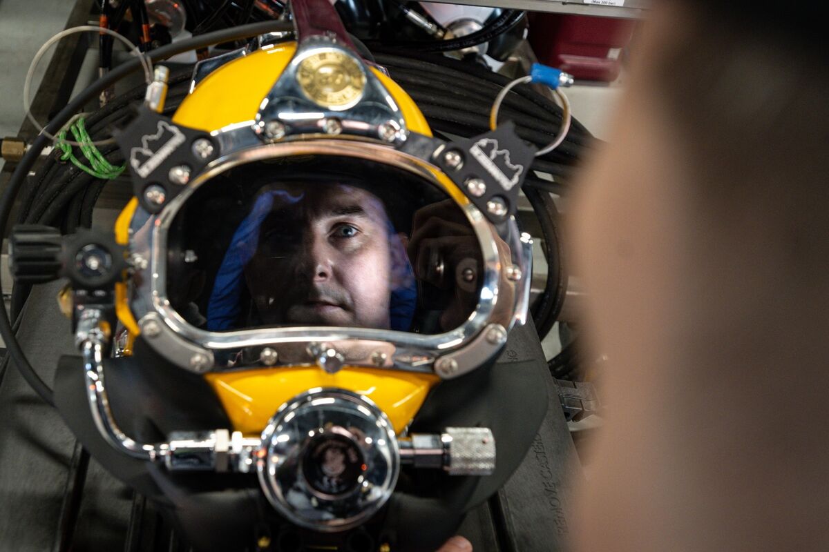 Lt Jason Croke reflected in the visor of a Kirby Morgan diving helmet. Picture: Chani Anderson Lt Jason Croke reflected in the visor of a Kirby Morgan diving helmet. Picture: Chani Anderson