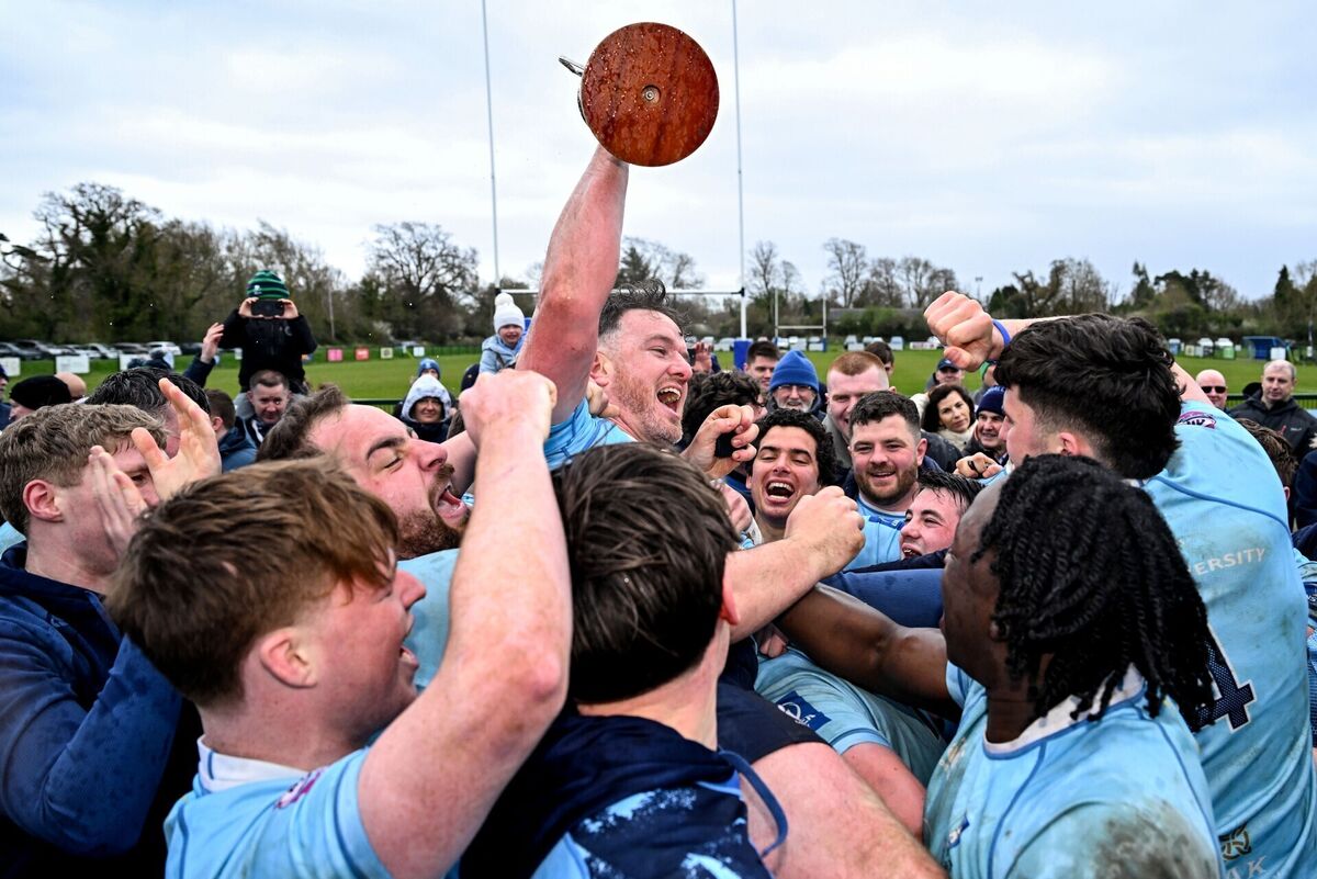 TRIUMPH: MU Barnhall captain Rob Holt and teammates celebrate with the Division 2 trophy in Parsonstown. Pic: Brendan Moran/Sportsfile