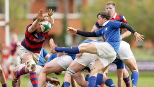 <p>OUTSTRETCHED: St. Mary's College's Rob Gilsenan is blocked by Fionn Gilbert. Pic: Laszlo Geczo/Inpho</p>