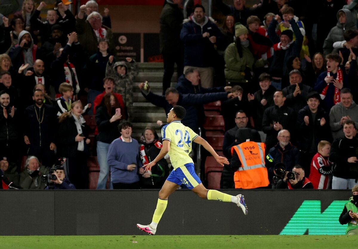 Charles runs to the home fans after scoring the late winner. Pic: Steven Paston/PA Charles runs to the home fans after scoring the late winner. Pic: Steven Paston/PA