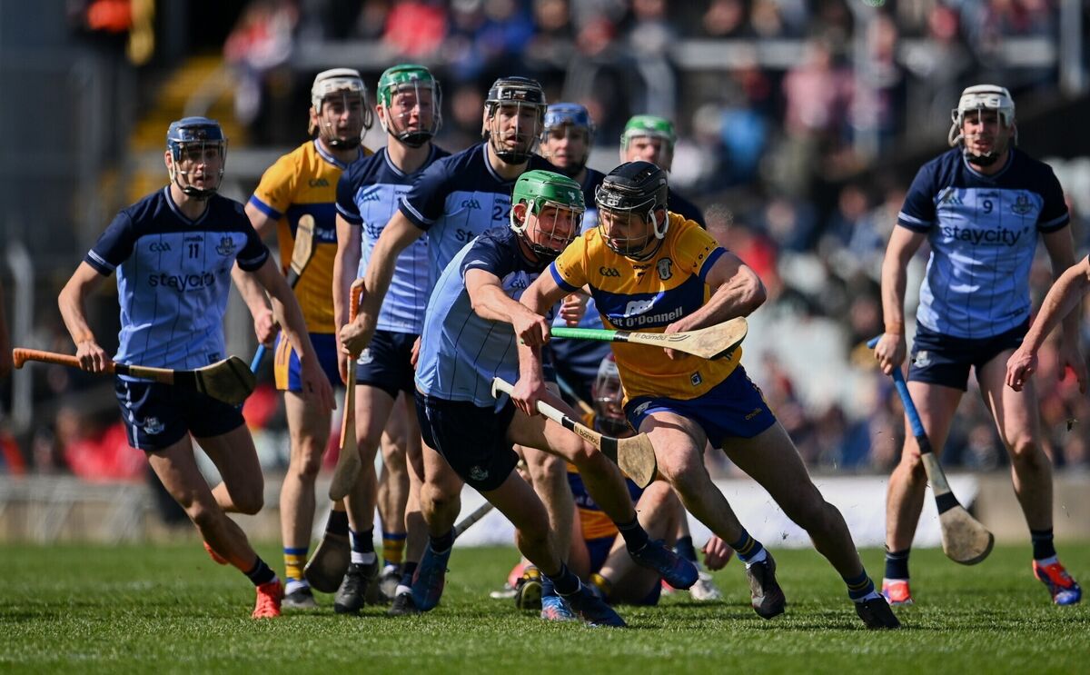 Cathal Malone of Clare in action against Paddy Doyle. Pic: Ben McShane/Sportsfile.
