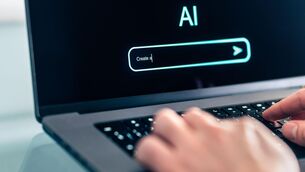 <p>2WBE6RT AI prompt chat bot. Search website to generate data, text or image. Man using computer with artificial intelligence app. Virtual assistant.</p>