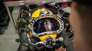 <p>Naval Service Diving Section officer in charge Lt Jason Croke reflected in the visor of a diving helmet during a visit to Haulbowline naval base in Cork Harbour by Irish Examiner security correspondent Cormac O'Keeffe and photographer Chani Anderson. </p>