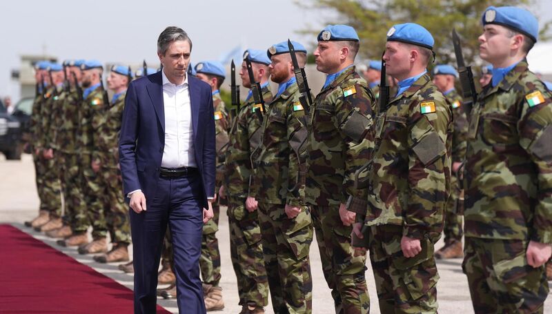 Then defence minister Simon Harris reviewing troops at Camp Shamrock near the border between Israel and Lebanon in March 2025. File picture: Niall Carson/PA