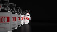 BOTOX Botulinum Toxin Bottles on Black Background