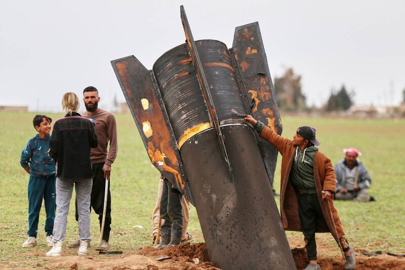 Exposing himself to the danger of unexploded ordnance, a boy touches an unexploded Iranian projectile that landed in an open field in the outskirts of Qamishli, eastern Syria, Wednesday, March 4, 2026.(AP Photo/Baderkhan Ahmad) Exposing himself to the danger of unexploded ordnance, a boy touches an unexploded Iranian projectile that landed in an open field in the outskirts of Qamishli, eastern Syria, Wednesday, March 4, 2026.(AP Photo/Baderkhan Ahmad)