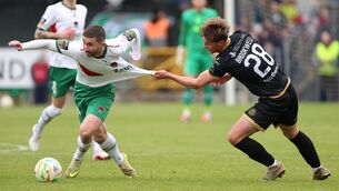 <p>OUT OF REACH: Niall Brookwell, Kerry FC, tries to contain Sean Maguire of Cork City. Pic: Jim Coughlan.</p>