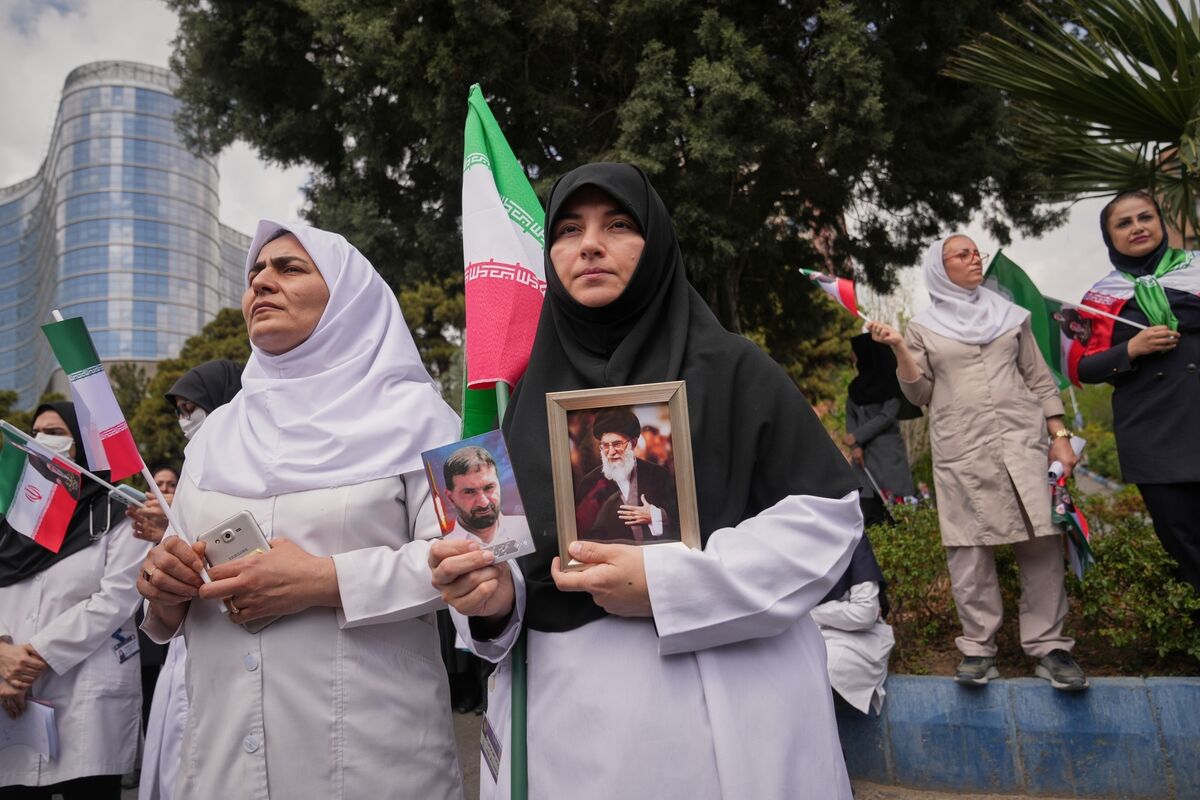 Medical workers protest against the US-Israeli military campaign outside Imam Khomeini Hospital in Tehran on Monday. Picture: Francisco Seco/AP