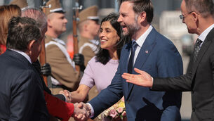 <p>The US vice president, centre right, and his wife Usha, centre left, were greeted at the airport in Budapest by Hungarian foreign minister Peter Szijjarto, right (Jonathan Ernst/Pool Photo via AP)</p> <p>The US vice president, centre right, and his wife Usha, centre left, were greeted at the airport in Budapest by Hungarian foreign minister Peter Szijjarto, right (Jonathan Ernst/Pool Photo via AP)</p>