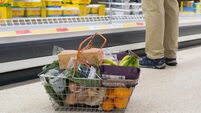 Shoppers at supermarket Sainsbury's for their weekly shopping when special prices are on offer, dealing with the cost of living
