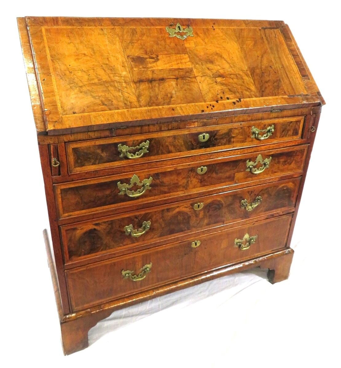 A Sheraton inlaid walnut bureau at Woodwards.