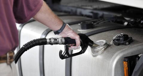 Man filling up the gas tank with gasoline