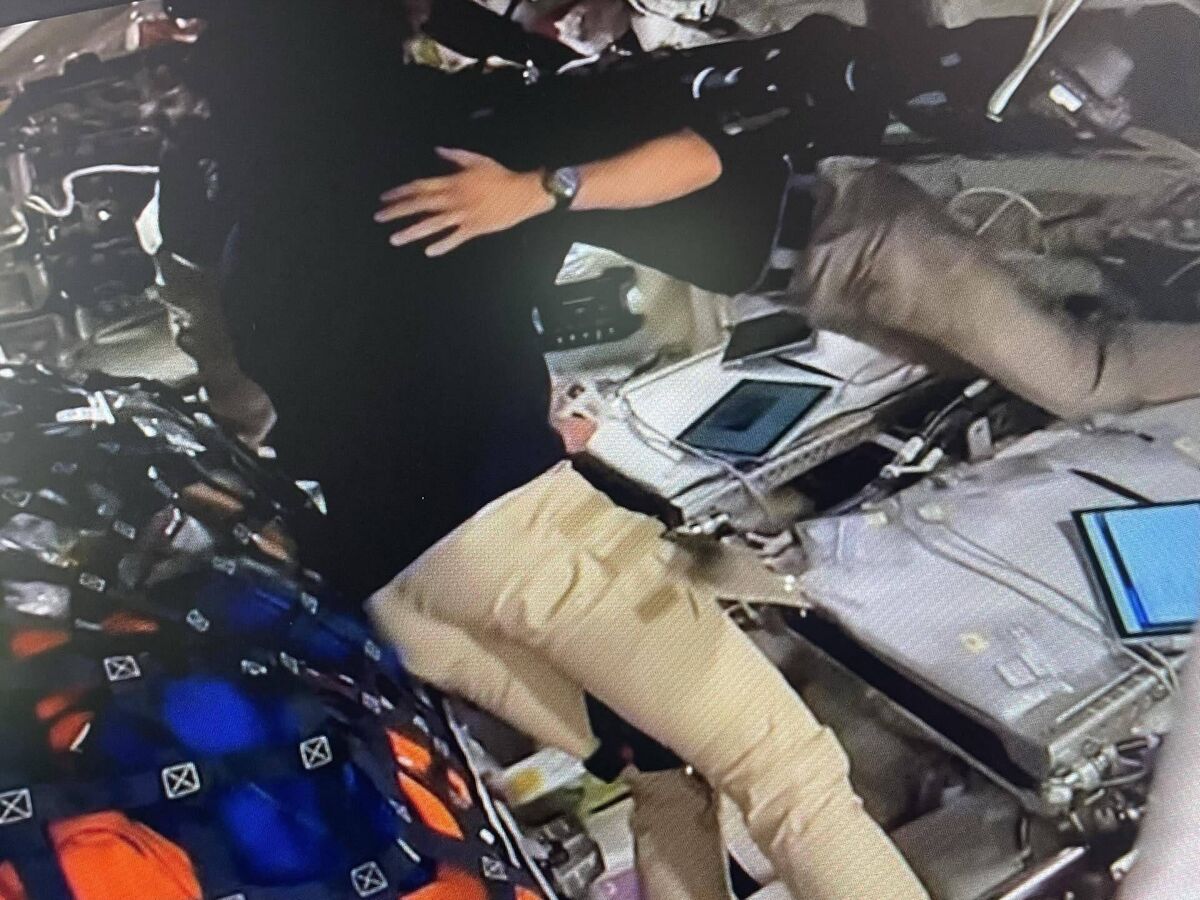 The Artemis II crew hugging after requesting that a crater on the moon be named after Reid Wiseman’s wife, Carol, who died two years ago.