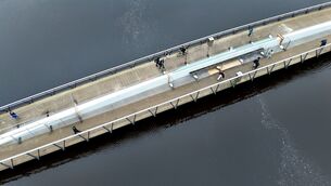 <p>The Mary Elmes Bridge in Cork City was damaged, with a portion of it crashing into the River Lee when the cherry-picker was driven on to the pedestrian bridge, causing some of the bridge floor to crash into the River Lee. Picture: Larry Cummins</p>