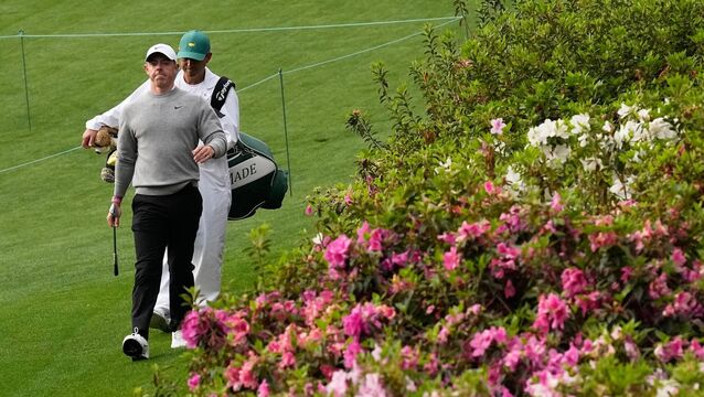 <p>KEY SHOT: Rory McIlroy walks to green on the sixth hole during a practice round ahead of the Masters. Pic: AP Photo/David J. Phillip.</p>