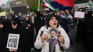 <p>Iran and Pakistan, which brokered the 11th-hour truce, both asserted that the ceasefire included Lebanon. A pro-government demonstrator in Iran holds a picture of Iran's Supreme Leader Mojtaba Khamenei during a gathering following the announcement of a two-week ceasefire. Picture: AP Photo/Francisco Seco</p>