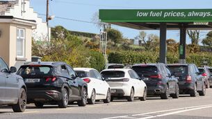 <p>Cars queue for fuel outside a service station in East Cork. Pic: Eamonn Farrell/RollingNews.ie</p>