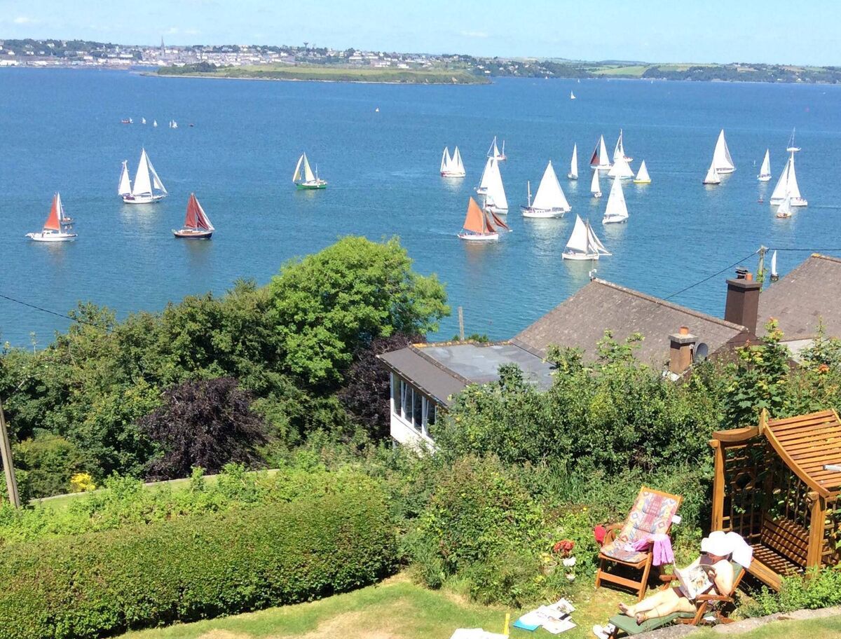 The town of Cobh is visible across the bay