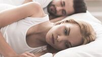 Anxious girl cannot sleep near her husband in bedroom