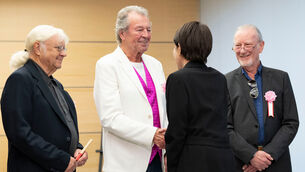 Japan’s Prime Minister Sanae Takaichi, greets Deep Purple members Ian Paice, Ian Gillan and Roger Glover (Yuichi Yamazaki/Pool Photo via AP)