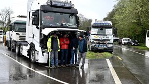 <p>Fuel protesters in Whitegate, Cork, shelter under the bonnet of a truck. Picture: Larry Cummins</p> <p>Fuel protesters in Whitegate, Cork, shelter under the bonnet of a truck. Picture: Larry Cummins</p>