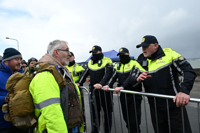  Public order unit moved to clear the blocked road. Gardai faced protesters forming a chain of locked arms on the main road of the village.. Picture: Larry Cummins