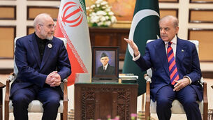 Iran’s Parliament Speaker Mohammad Bagher Ghalibaf, left, meets Pakistani Prime Minister Shehbaz Sharif (Pakistan Prime Minister Office via AP)