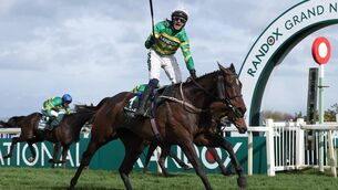 <p>SUPERSTAR Paul Townend and I Am Maximus cross the finish line to take victory in the Randox Grand National at Aintree. Pic: Michael Steele/Getty Images</p>
