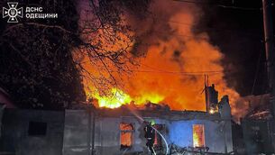 A rescue worker puts out a fire at a residential house destroyed by a Russian drone strike on Odesa (Ukrainian Emergency Service via AP) A rescue worker puts out a fire at a residential house destroyed by a Russian drone strike on Odesa (Ukrainian Emergency Service via AP)