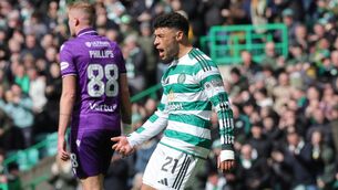 <p>LOOKING UP: Celtic's Alex Oxlade-Chamberlain celebrates scoring the winner. Pic: Steve Welsh/PA Wire.</p>