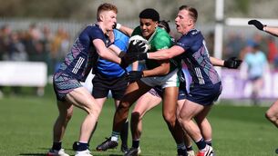 <p>DOUBLE TEAM: London's Josh Obahor tries to find a way through the Mayo defence. Pic: INPHO/Gerry McManus</p>
