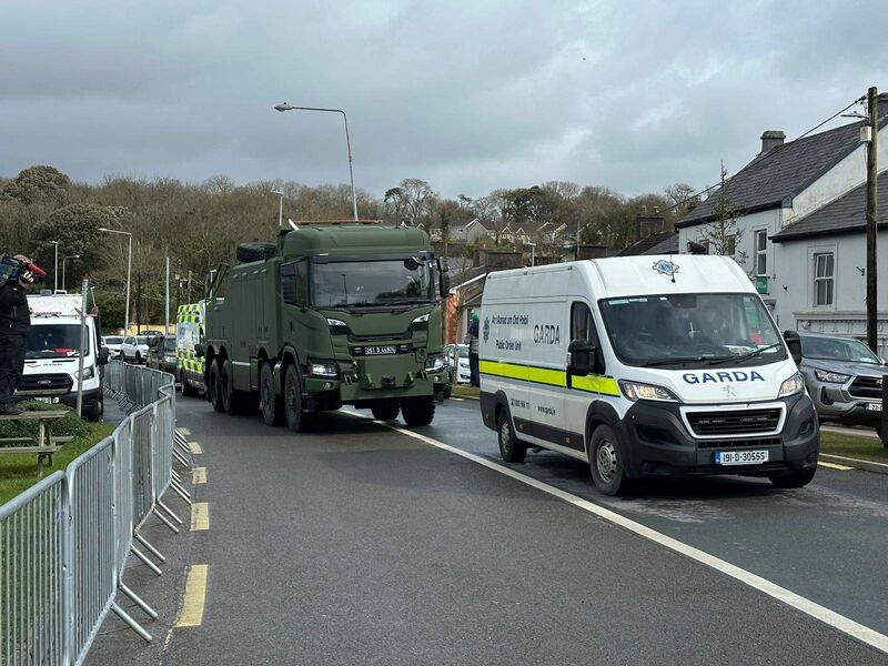 Army engineers arriving with heavy lifting equipment to move tractors and trucks blocking the road at Cork's Whitegate refinery on Saturday. Picture: Neil Michael