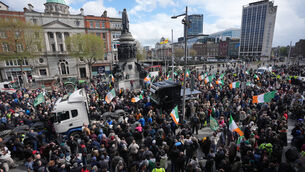 <p>Protesters on O’Connell Street in Dublin (Niall Carson/PA)</p>