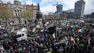 <p>Protesters on O’Connell Street in Dublin (Niall Carson/PA)</p>