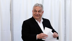Hungary’s Prime Minister Viktor Orban prepares to cast his ballot at a polling station in Budapest (Petr David Josek/AP)