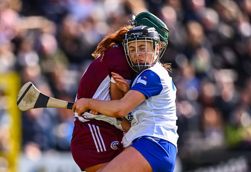 Róisín Black of Galway meets Keeley Corbett Barry of Waterford with a shoulder. Pic: Piaras Ó Mídheach/Sportsfile.