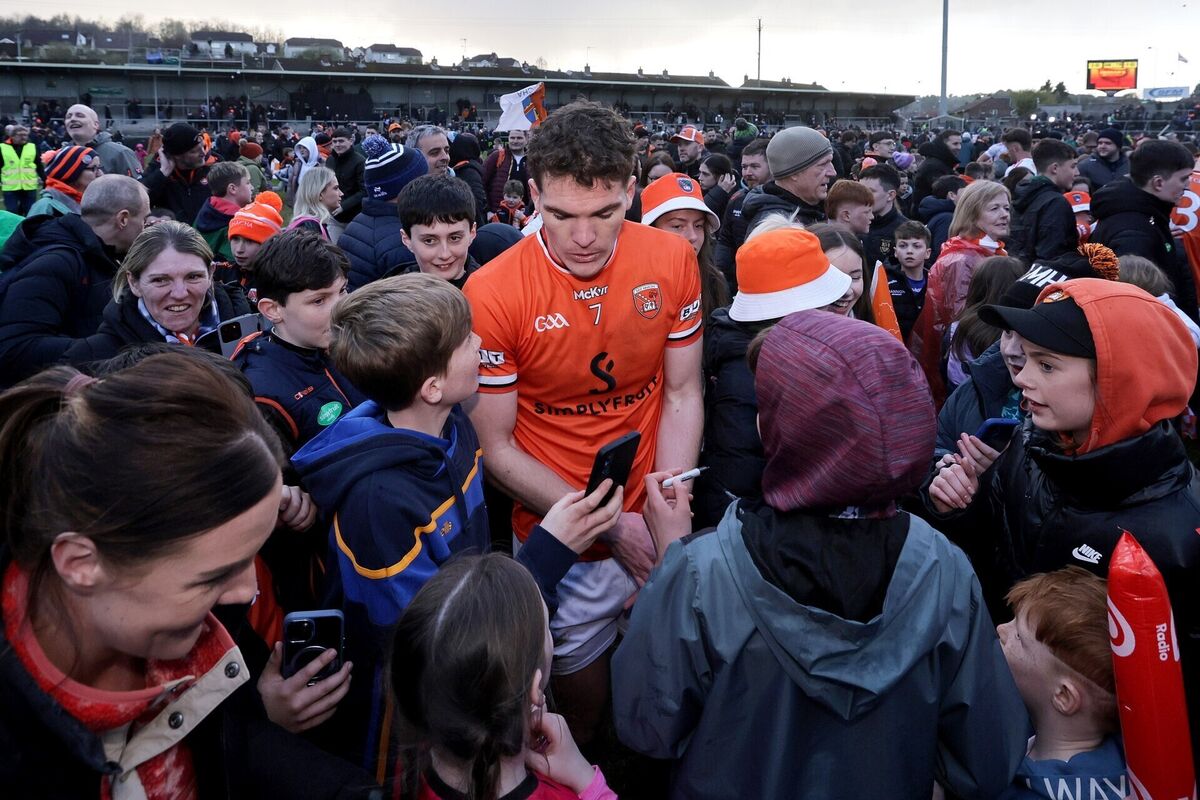 Armagh's Jarly Óg Burns signs autographs after the game. Pic: ©INPHO/Laszlo Geczo