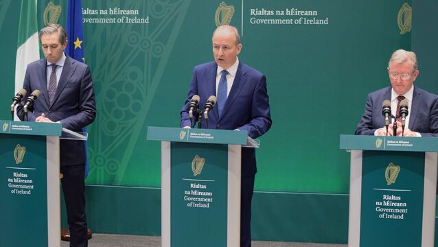 <p>In a scene redolent of the worst days of the covid pandemic, Tánaiste Simon Harris, Taoiseach Micheál Martin, and junior minister Seán Canney outlined a package that they hope will quell the fuel price protests. Picture: Cillian Sherlock/PA</p>