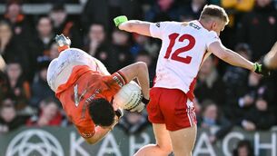 <p>UP IN THE AIR: Armagh's Jarly Og Burns in action against Tyrone's Ben McDonnell. Pic: Ramsey Cardy/Sportsfile</p> <p>UP IN THE AIR: Armagh's Jarly Og Burns in action against Tyrone's Ben McDonnell. Pic: Ramsey Cardy/Sportsfile</p>