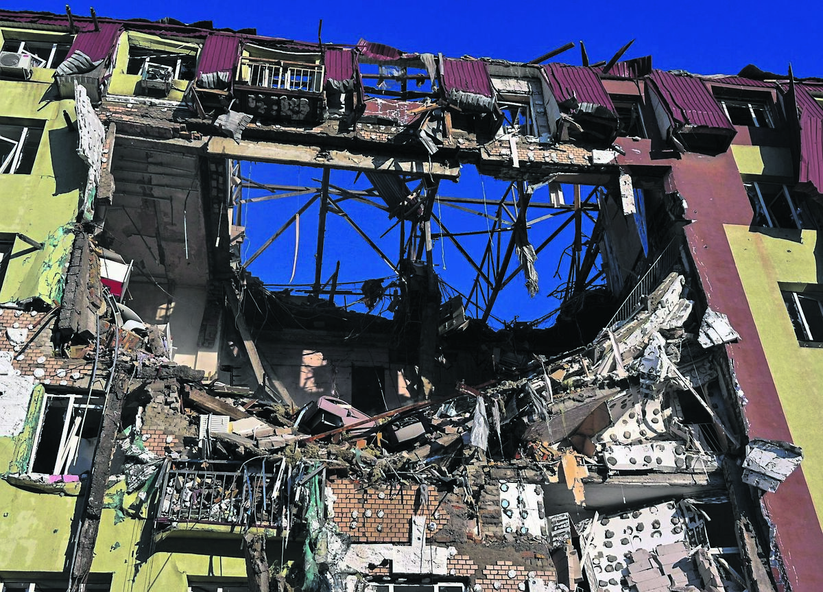A bombed apartment building: Ukrainian cities go dark at night to elude Russian airstrikes. It doesn’t always work. 	Picture: Michael Shtekel/AP
                    